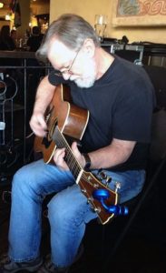 Ken Fleming playing guitar