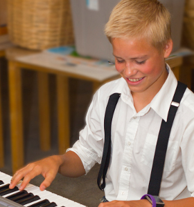 young man playing keyboard
