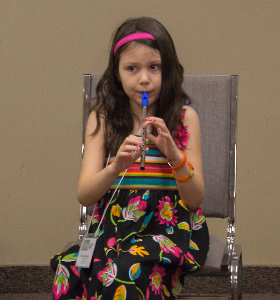 girl playing whistle